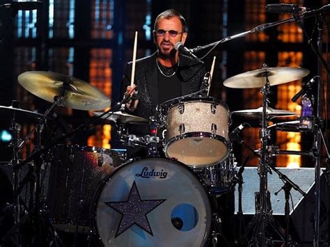 Beatles drummer Ringo Starr knighted at Buckingham Palace