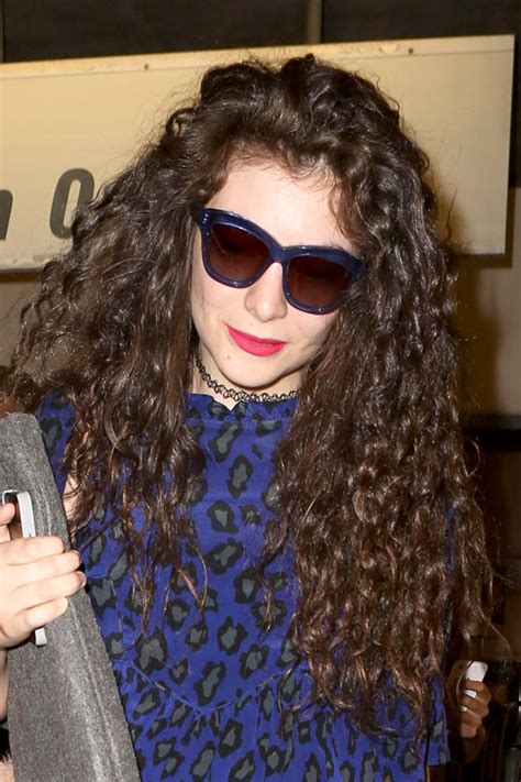 Lorde Curly Medium Brown Messy Hairstyle | Steal Her Style