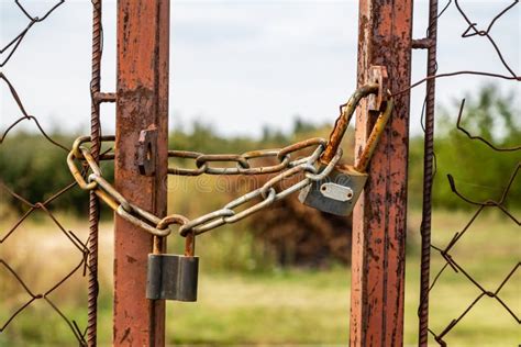 Old Rusty Gate Locked with Padlock Stock Image - Image of closeup, iron ...