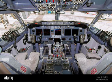 A view of the cockpit of a large commercial airplane a cockpit ...