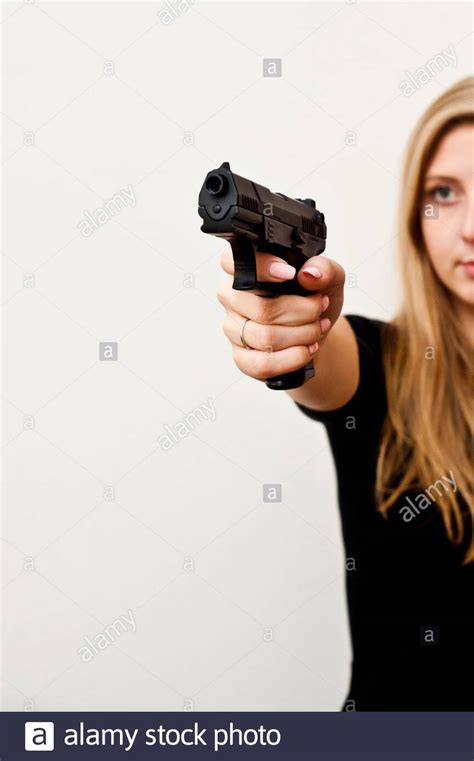 Woman Pointing Gun High Resolution Stock Photography and Images - Alamy