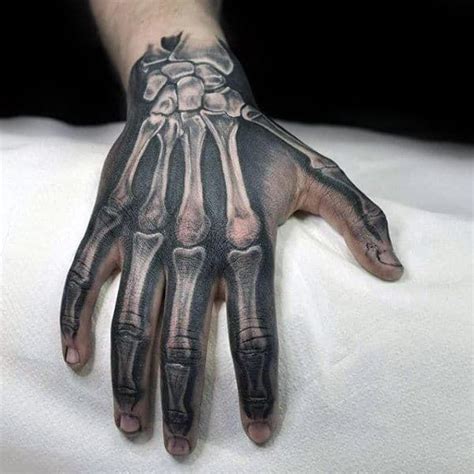 73 Cool Skeleton Hand Tattoo Designs for Men | Bone hand tattoo ...