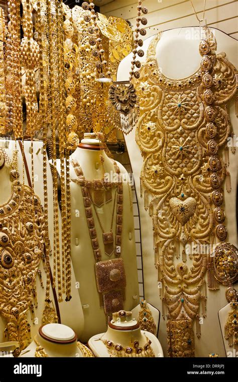 Gold jewelry in shop window of gold souk, Dubai, United Arab Emirates ...