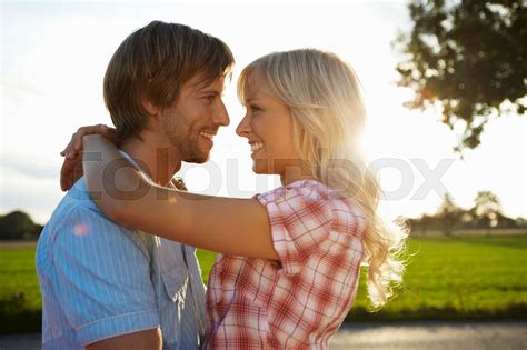 Couple close/hugging during sunset | Stock image | Colourbox