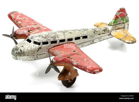 antique tin toy plane isolated on white background Stock Photo - Alamy