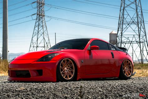 Slammed Nissan 350z with Black headlights and Bronze ACE Wheels — CARiD ...