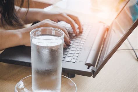 Business Woman Drinking Fresh Water While Working On Computer Stock ...