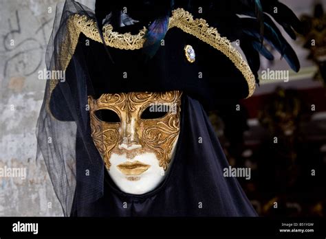 Typically Venetian black and gold mask with veil and handpainted ...