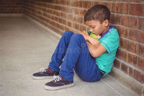 Upset Lonely Child Sitting by Himself Stock Photo - Image of ...