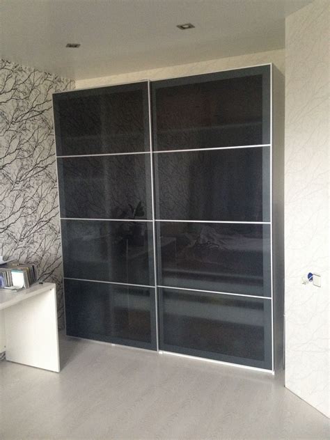 IKEA Pax wardrobe with gray glass sliding doors