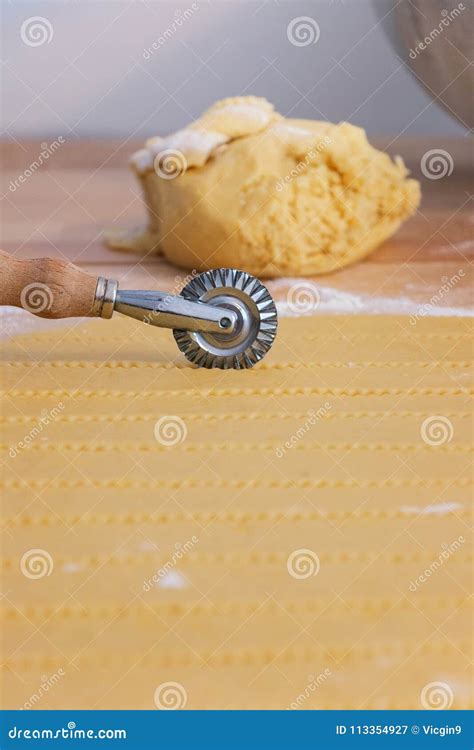 Pastry Cutter Wheel Cuts a Layer of Puff Pastry Stock Image - Image of ...