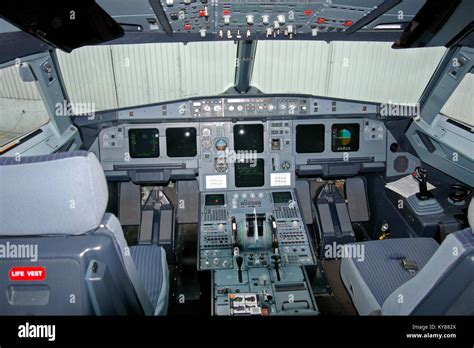 Air Astana Airbus A320 P4-PAS cockpit with power on. Glass cockpit ...