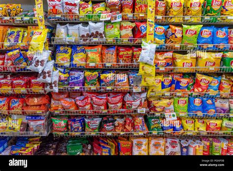 PATTAYA, THAILAND - JULY 10: This is a snacks aisle in a 7-Eleven ...