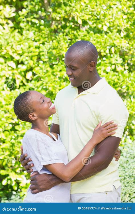 Happy Smiling Couple To Hug Stock Photo - Image of domestic, green ...