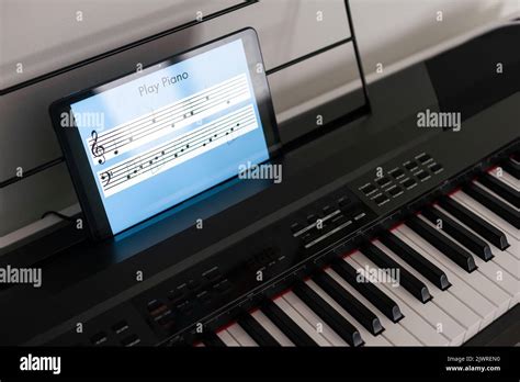 Piano synthesizer app on tablet and musical instrument concept Stock ...