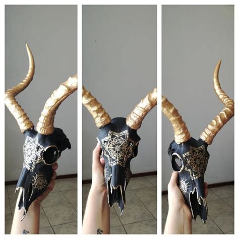 Painted Impala antelope skull black and gold. Animal skull art