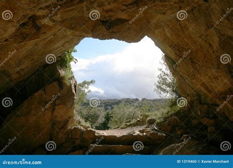 Cave exit stock photo. Image of round, clouds, entrance - 1319460