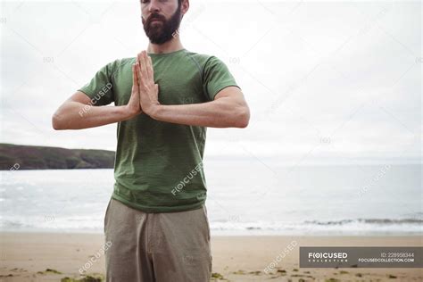 Man performing yoga on beach — vitality, strength - Stock Photo ...