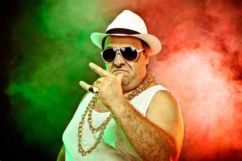 Italian funny mafia boss rapper with undershirt and sunglasses on smoky ...