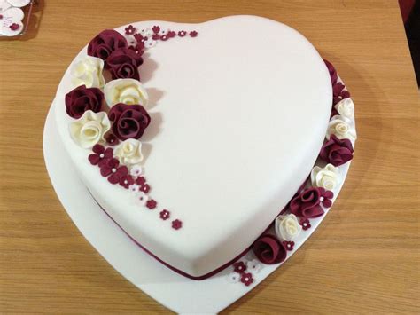 Heart Shaped Wedding Cake With Whimsical Flowers - CakeCentral.com