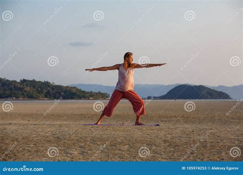 Man is Doing Yoga on the Beach Stock Image - Image of health, calm ...