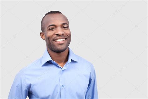 Young black man smiling at camera Stock Photo by ©gstockstudio 37034497