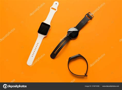 Different Modern Smartwatches Orange Background Stock Photo by ...