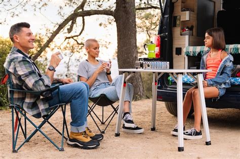 Premium Photo | Family camping in with their camper van