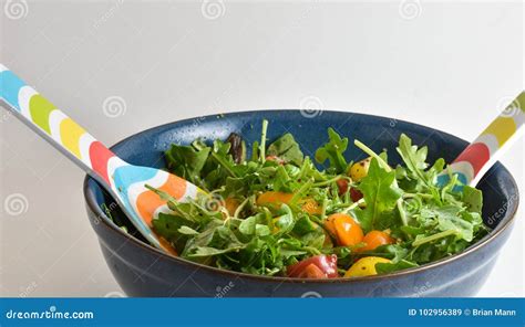 Healthy Vegan Salad Being Mixed in a Bowl Stock Image - Image of green ...