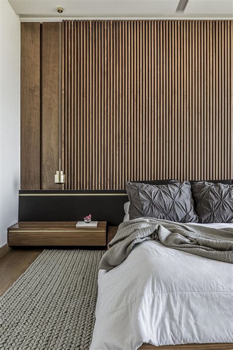 An Accent Wall Of Vertical Wood Helps To Accentuate The Feeling Of ...