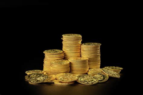 Stacks and a pile of old gold coins Photograph by Stefan Rotter - Pixels