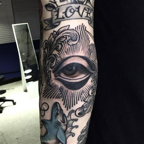 Eye tattoo on the elbow - Tattoogrid.net