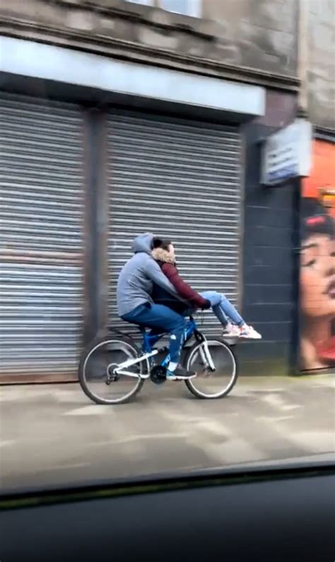 Hilarious cyclist and passenger unintentionally recreating E.T. scene