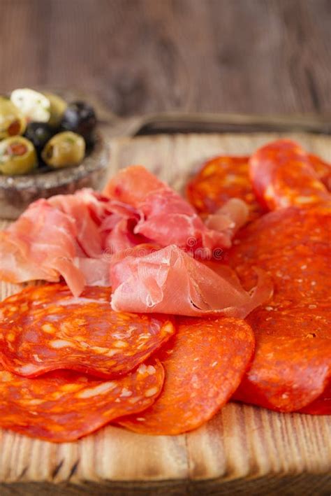 Platter of Serrano Jamon Cured Meat, Chorizo and Olives Stock Photo ...