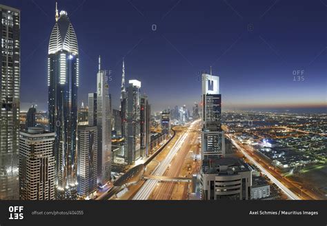 Night view of downtown Dubai skyline stock photo - OFFSET