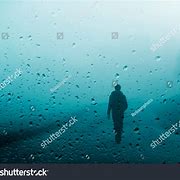 Image result for Man Walking in Rain Light