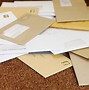 Image result for Pile of Mail On Desk