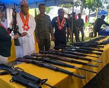 Image result for Stacks of Surrendered Guns