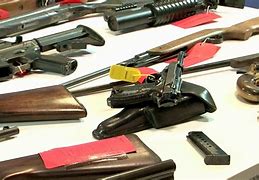 Image result for Stacks of Surrendered Guns