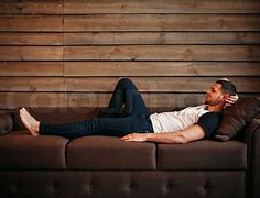 Image result for Man Lounging On Sofa