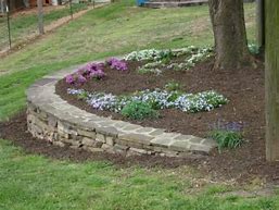 Image result for Stacked Stone Flower Bed