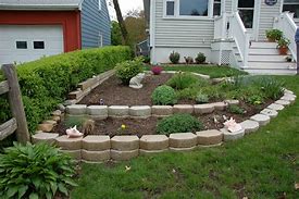 Image result for Stacked Stone Flower Bed