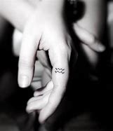 Image result for Aquarius Ring Finger Tattoo