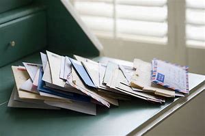 Image result for Pile of Mail On Desk