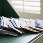 Image result for Pile of Mail On Desk