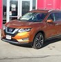 Image result for Orange Nissan Rogue