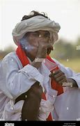 Image result for Smoking a Bidi