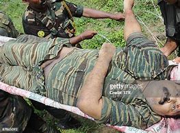 Image result for Tamil Tiger Leader Body