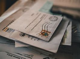 Image result for Pile of Mail On Desk