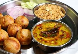 Image result for Rajasthani Dal Bati Churma in Goldan Plat